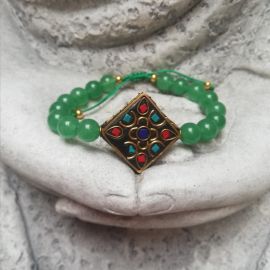 Pulsera en piedra jade con dije tibetano